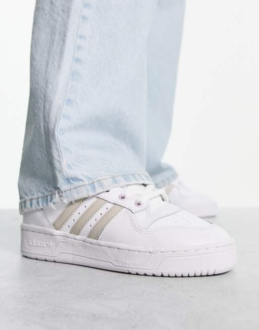 adidas Originals Rivalry low sneakers in white and beige