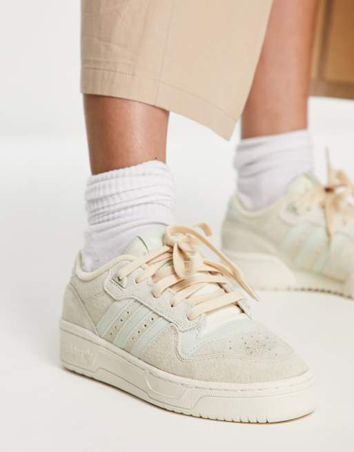 adidas Originals Rivalry Low trainers in off white and sage green