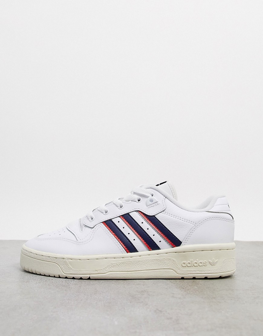 Adidas Originals Rivalry Low trainers in white with navy stripes