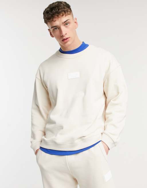 adidas Originals RYV rubber badge crew neck sweat in cream | ASOS