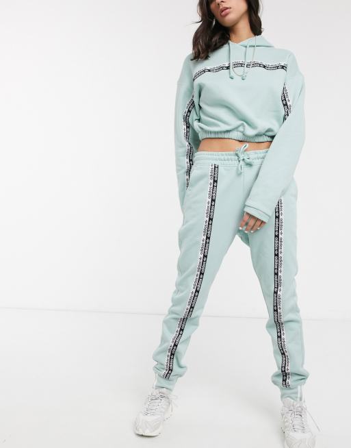 Adidas originals ryv cheap taping high waist jogger