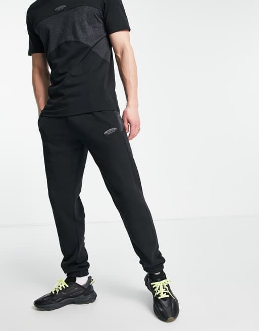 adidas Originals RYV trackies in black with fabric contrast panel | ASOS