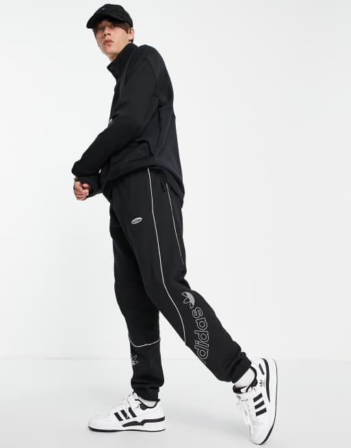 adidas Originals RYV trackies in black with leg branding