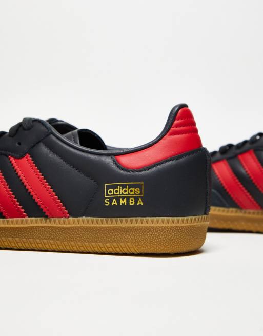 Red adidas shoes with black stripes online