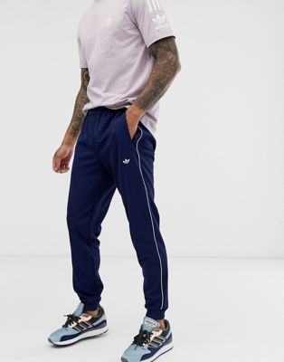 adidas cuffed tracksuit bottoms in navy