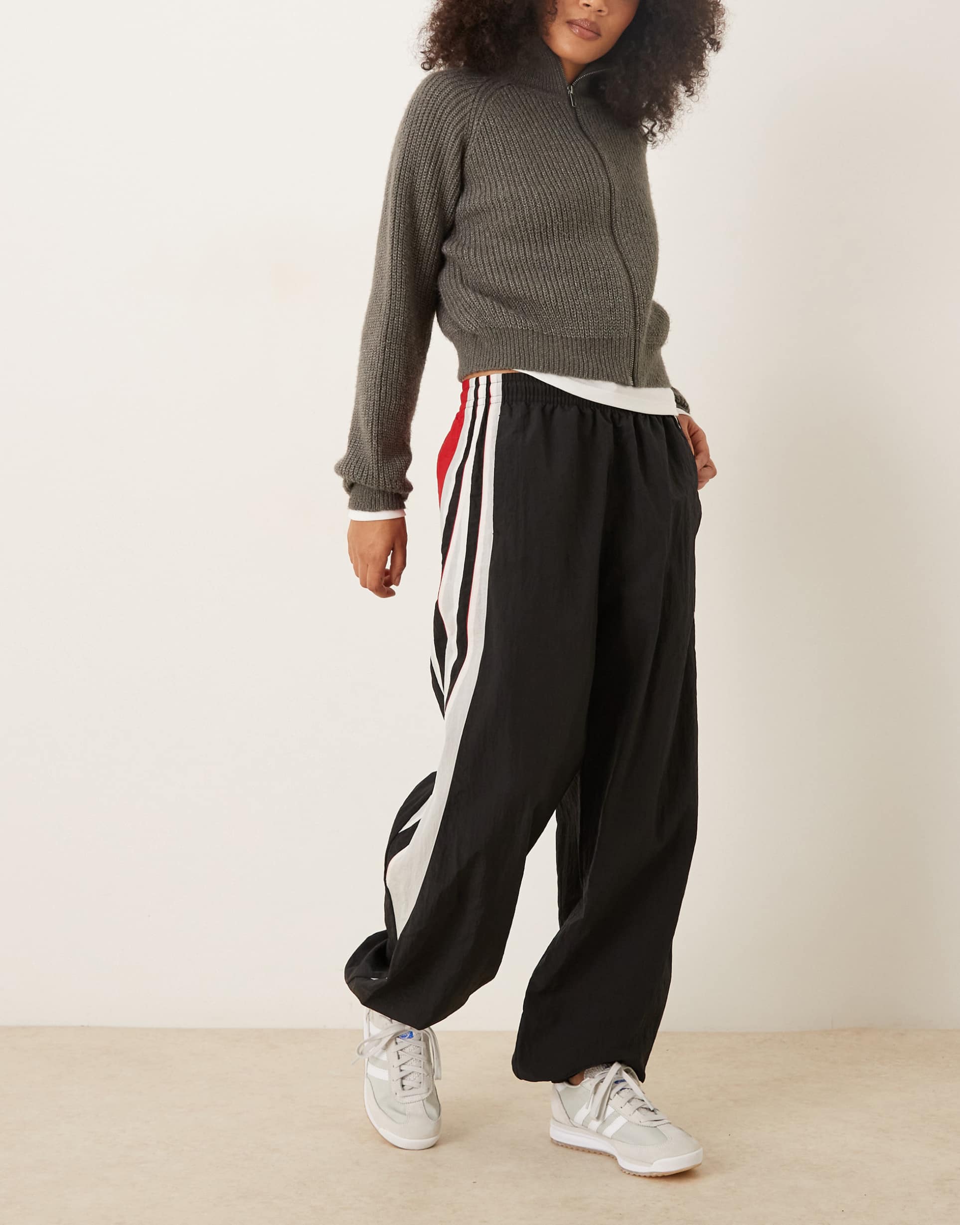 adidas originals santigao pants in black with red detail