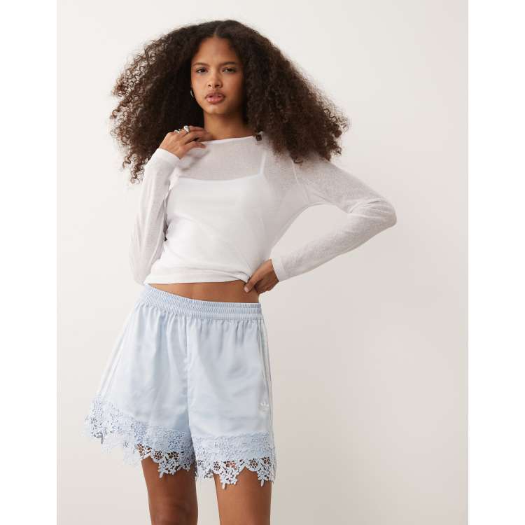 adidas Originals satin shorts with lace hem in light blue | ASOS