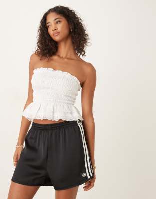 adidas Originals adidas Originals satin sprinter shorts in black with ruffle 3 stripe