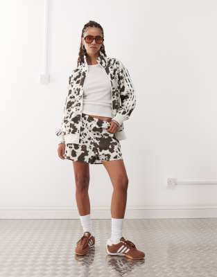 adidas Originals adidas Originals satin sprinter shorts in cow print-Multi