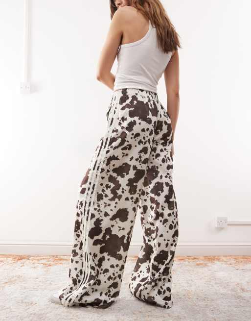 adidas Originals satin wide leg track pants in cow print 