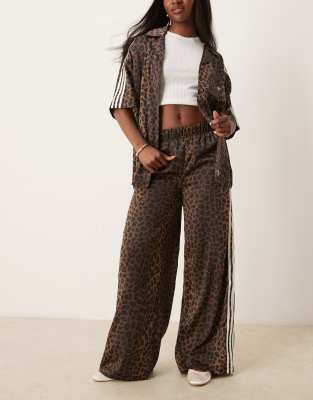 adidas Originals adidas Originals satin wide leg track pants in leopard print-Multi