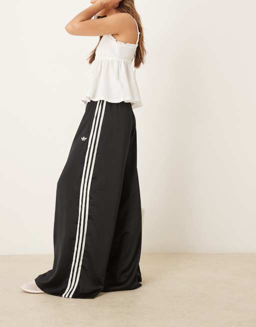 adidas Originals satin wide leg trackies in black with ruffle 3 stripe