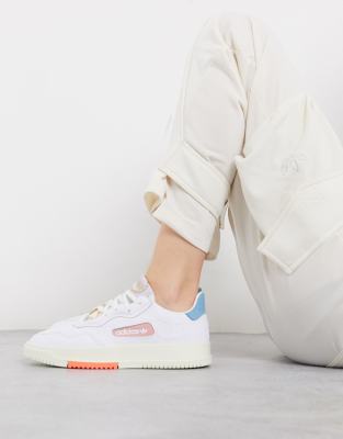 adidas originals sc premiere sneaker in white and pink