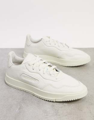 adidas originals sc premiere sneaker in white and pink