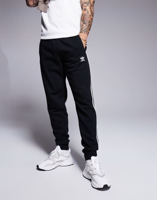 adidas Originals Schwarze Jogginghose mit drei Streifendesign