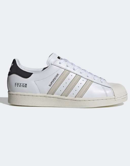 adidas Originals Sigseries Superstar sneakers in white and navy ASOS