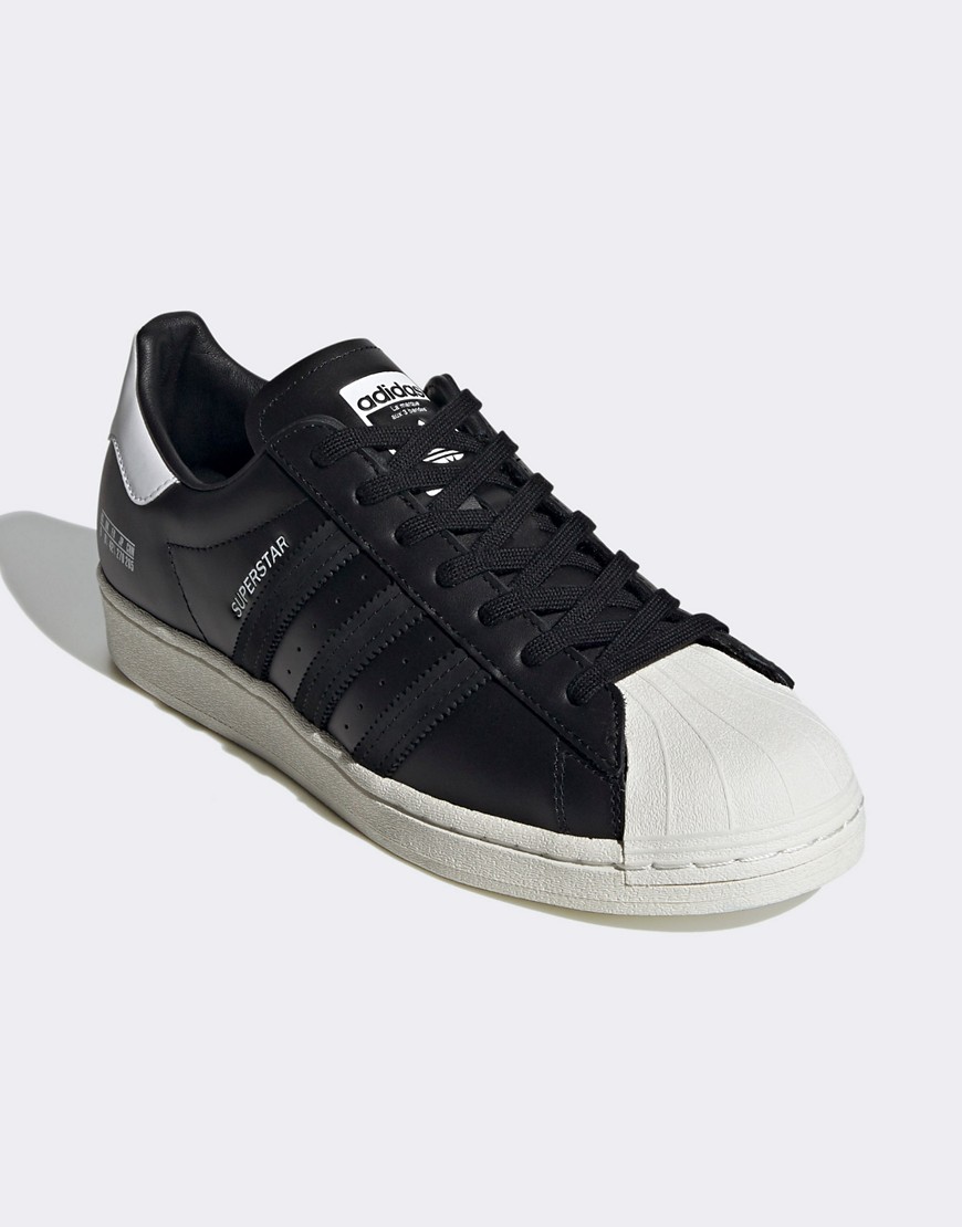 Adidas Originals Sigseries Superstar trainers in white and black