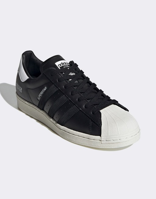 adidas Originals Sigseries Superstar trainers in white and black