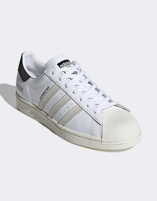 adidas Originals Sigseries Superstar trainers in white and navy