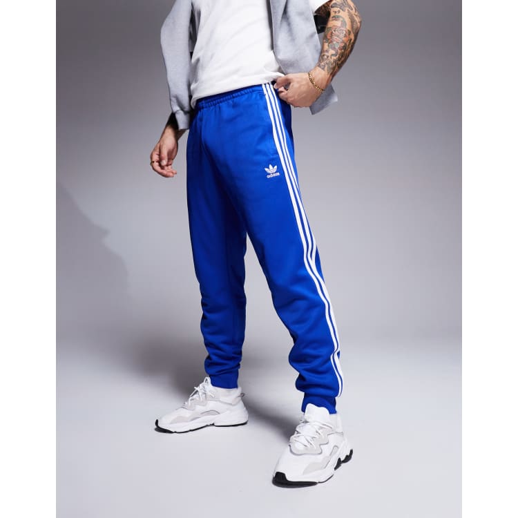adidas Originals skinny trackies in blue ASOS