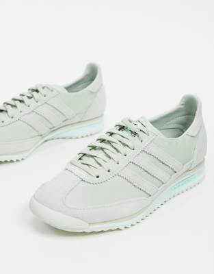 mint green adidas sneakers