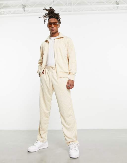 adidas Originals – Spodnie dresowe w neutralnym kolorze w monogramowy wzór z logo