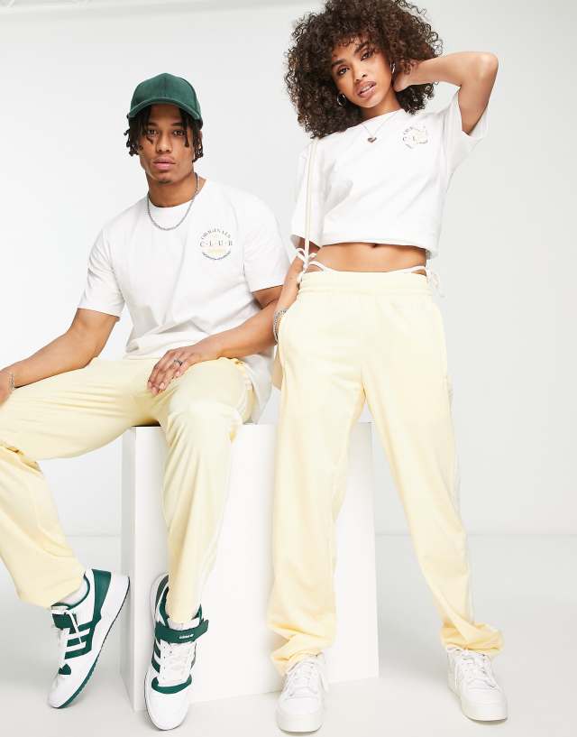 adidas Originals 'Sports Resort' three stripe wide leg track pants in yellow