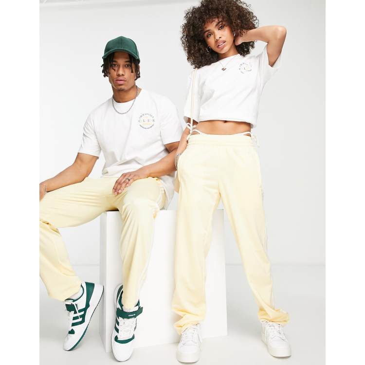 Adidas track pants yellow stripe discount