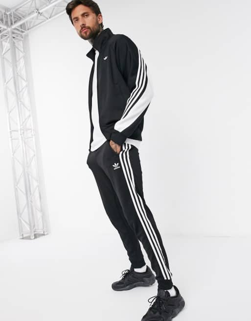 Tuta adidas nera strisce bianche clearance