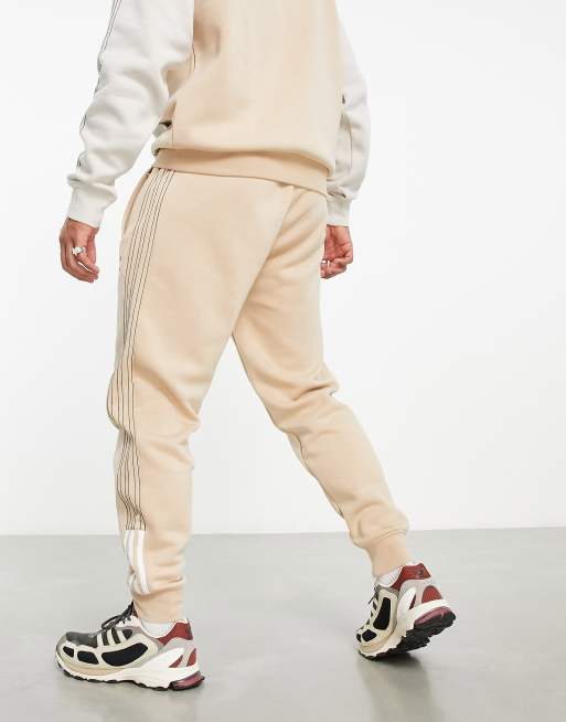 adidas Originals SPRT joggers in beige