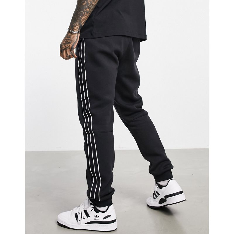 Pantaloni e leggings Activewear adidas Originals - SPRT - Joggers neri con pannelli in raso