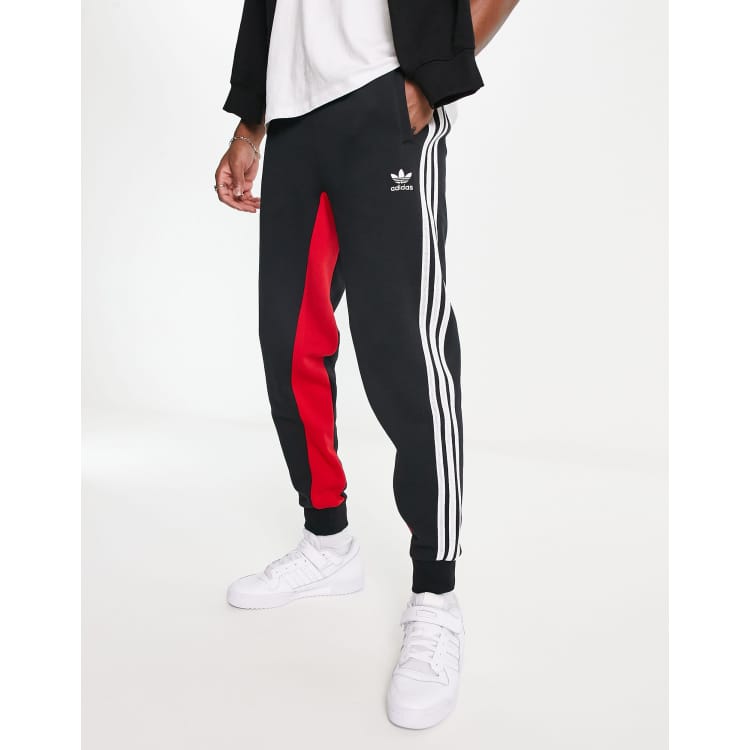 adidas Originals SPRT three stripe joggers in black and red ASOS