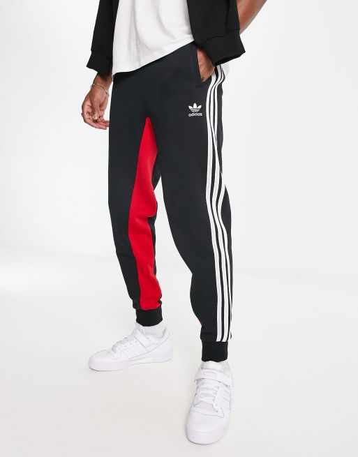 adidas Originals SPRT three stripe joggers in black and red ASOS