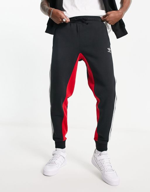 adidas Originals SPRT three stripe joggers in black and red ASOS