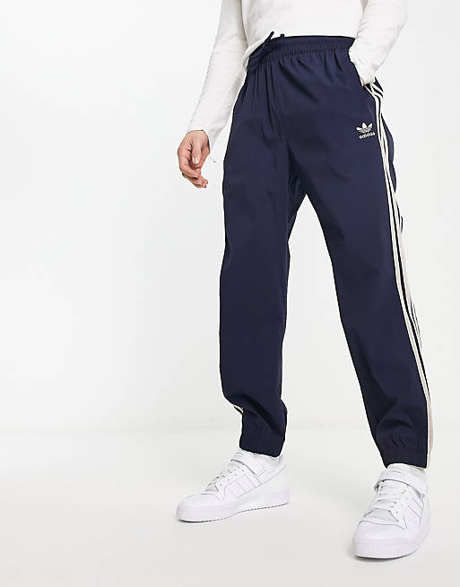 adidas Originals SPRT three stripe sweatpants in navy | ASOS