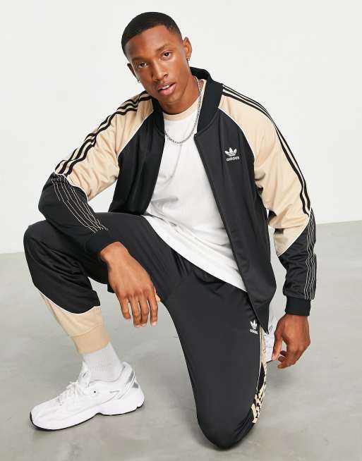 Adidas black and store beige jacket