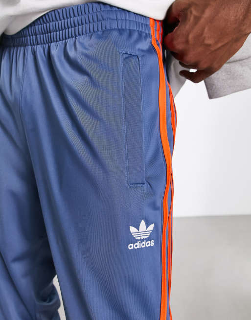 Adidas tracksuit cheap blue and orange