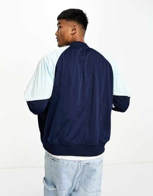 adidas Originals SPRT tricot track top in navy and light blue