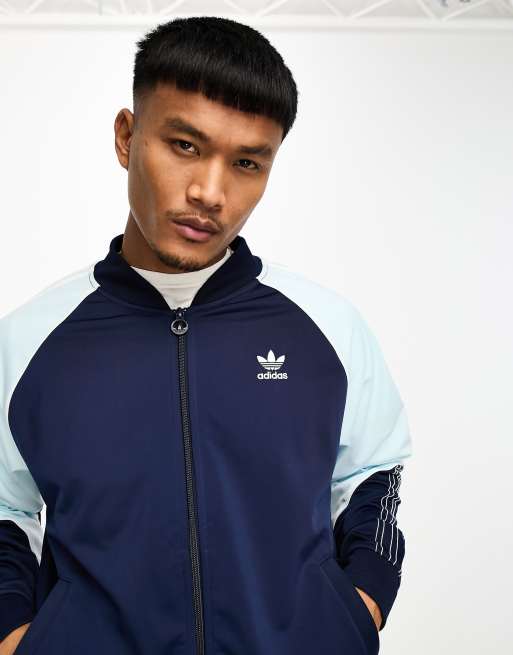 adidas Originals SPRT tricot track top in navy and light blue