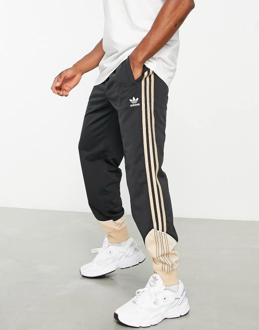adidas Originals – SPRT US – Svarta och beige träningsbyxor