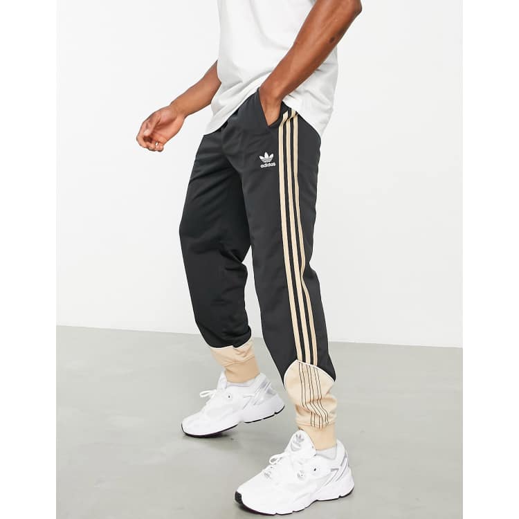 adidas Originals SPRT US track pants in sand and black | ASOS