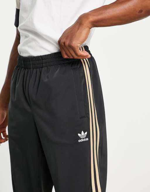 adidas Originals SPRT US track pants in sand and black