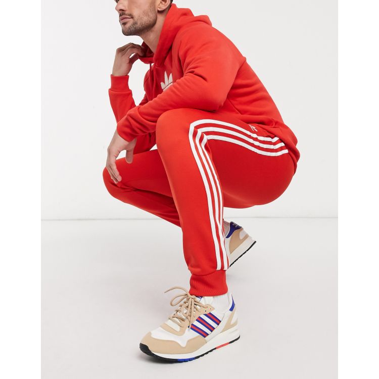 adidas Originals SST Pantalon de surveteemnt Rouge luxuriant ASOS