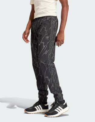 adidas Originals Allover print SST tracksuit bottoms in Black - ASOS Price Checker