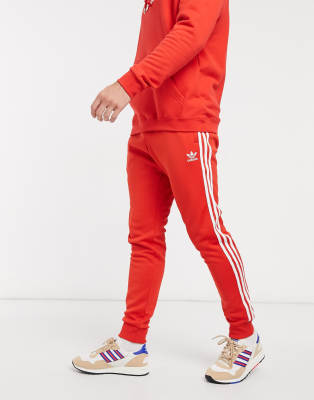 pantaloni adidas rosso