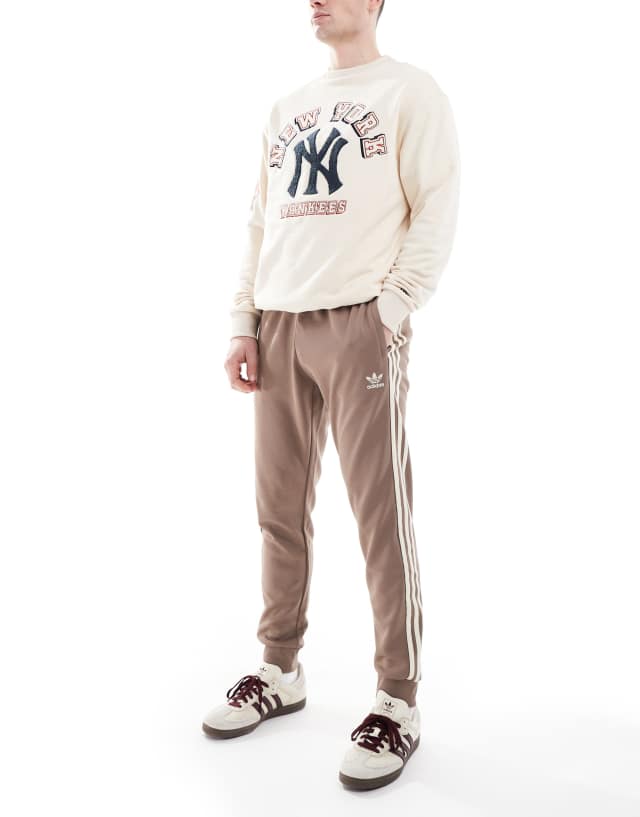 adidas Originals SST Track Pants in brown | ASOS