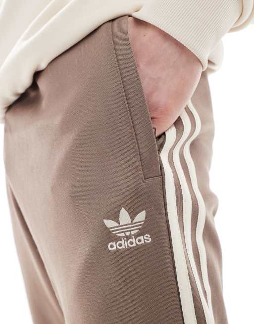 adidas Originals SST Track Pants in brown ASOS