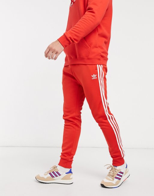 adidas Originals SST track pants in lush red