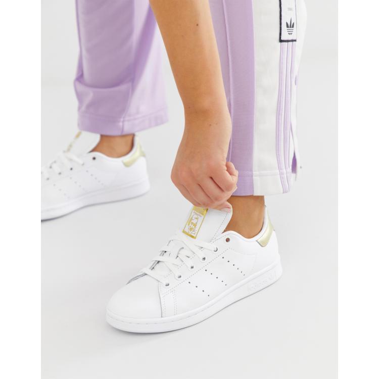 adidas Originals Stan Smith in white and metallic gold