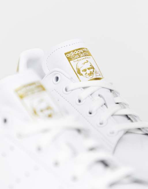 adidas Originals Stan Smith in white and metallic gold